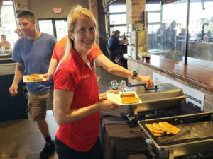 State Rep. Joy Goeben serves at the Hobart Pancake and Porkie Breakfast.