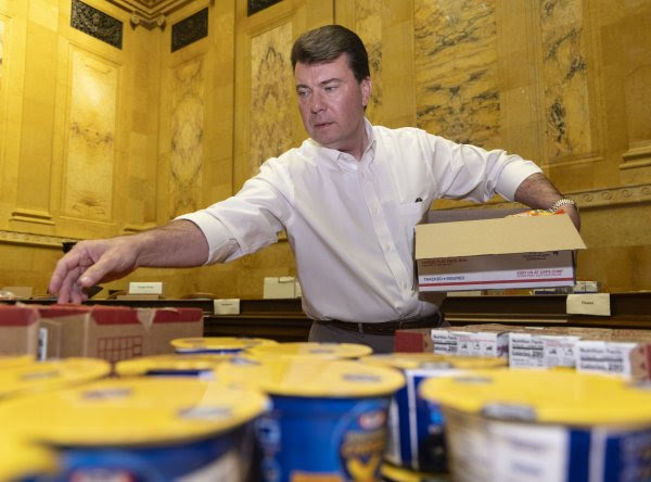 A staffer for Wisconsin State Rep. Dave Murphy packing boxes for Operation We Love Our Troops.