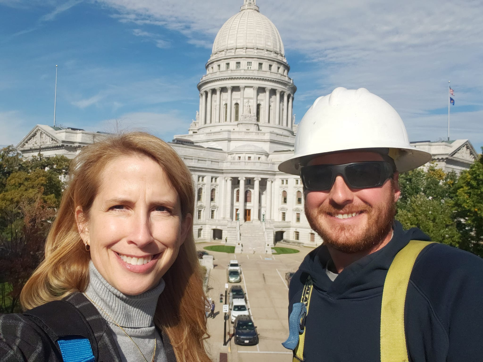 Wisconsin State Rep. Joy Goeben has a great view of the State Capitol in a bucket truck with Municipal Electric Utilities of Wisconsin.