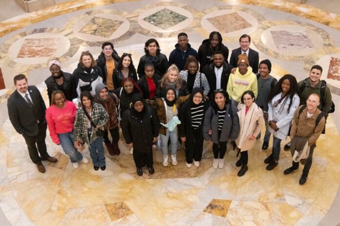 Wisconsin State Rep. Nate Gustafson with a group in the Capitol rotunda.