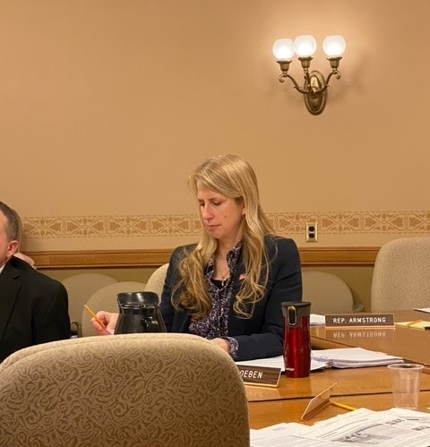 Wisconsin State Rep. Joy Goeben considers submitted testimony on AB 689: Relating to pay for performance grant requirements, use of public lands to provide temporary residence for the homeless, and providing a penalty.