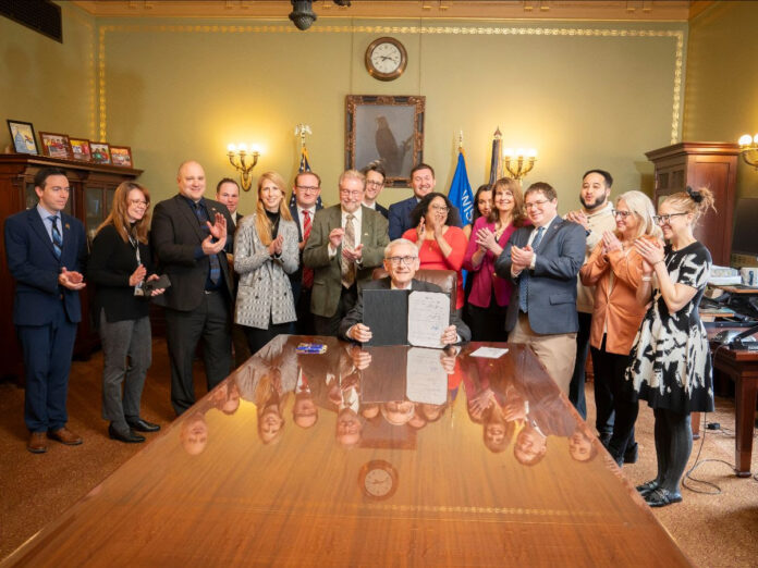 Governor Evers, Assembly Representatives, Senators, staff and invited guests after legislation providing whistleblower protections to election officials was signed into law.