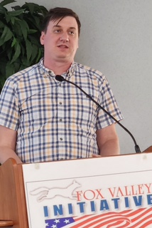 Eric Balza of Child Care Resource and Referral, Inc. addressed child care reform at the June 2 meeting of Fox Valley Initiative.