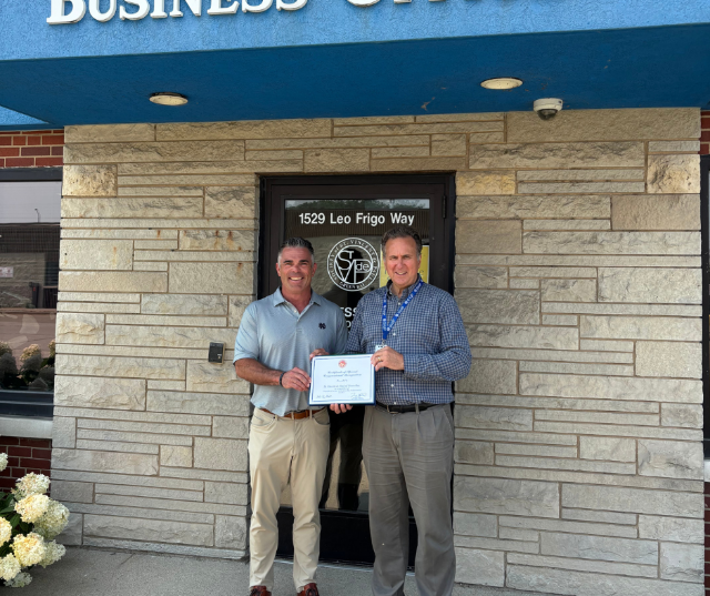 Congressman Tony Wied presented a Congressional certificate to St. Vincent de Paul Executive Director Bill Gosse for their recognition as a "Nonprofit of the Day" at the Green Bay Packers Training Camp.