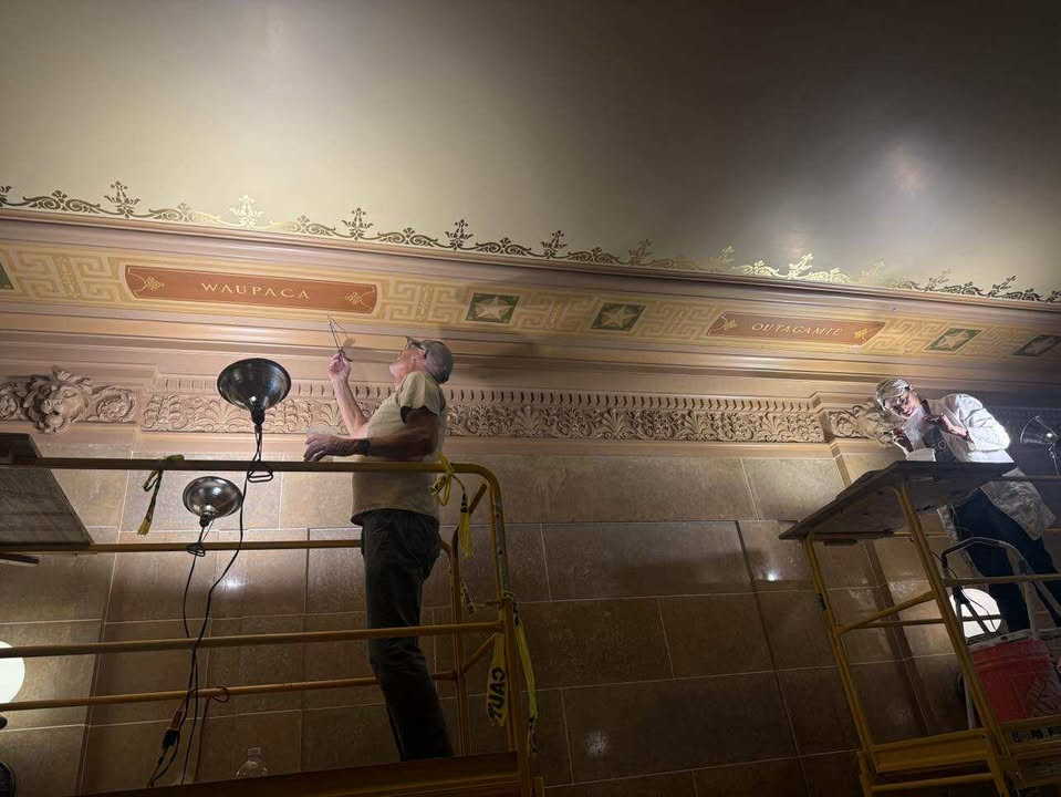 Capitol maintenance restoring the ceiling stenciling for Outagamie and Waupaca counties.