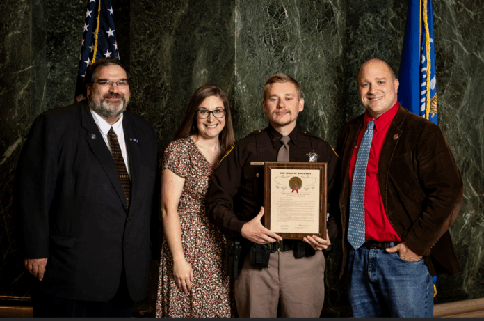 State Sen. Andre Jacque and State Rep. Shae Sortwell presented Deputy John Kowalski from the Brown County Sheriff's Office with the First Responder of the Year award.