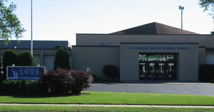 Some properties surrounding Xavier Middle School that are currently zoned residential but are owned by the school are up for rezoning to Public Institutional.  The school system would like to combine these few residential plats into one and, by all accounts, make them into an overflow parking lot for the school property. 