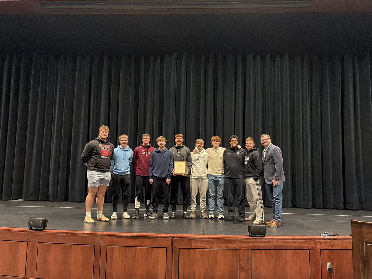 Wisconsin State Rep. Nate Gustafson visited Winneconne High School to present a legislative citation to the Winneconne football team for winning the Division 4 WIAA State Championship.