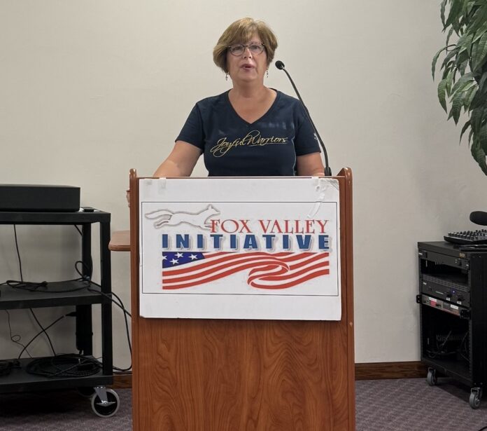 Laura Ackmann gave an update on Moms for Liberty activities and discussed “protecting children from sexual predators in our schools.”